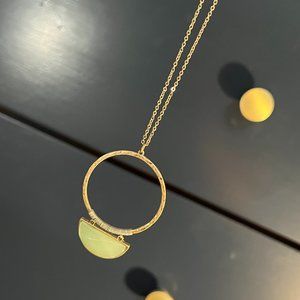 Long gold necklace with minty green stone